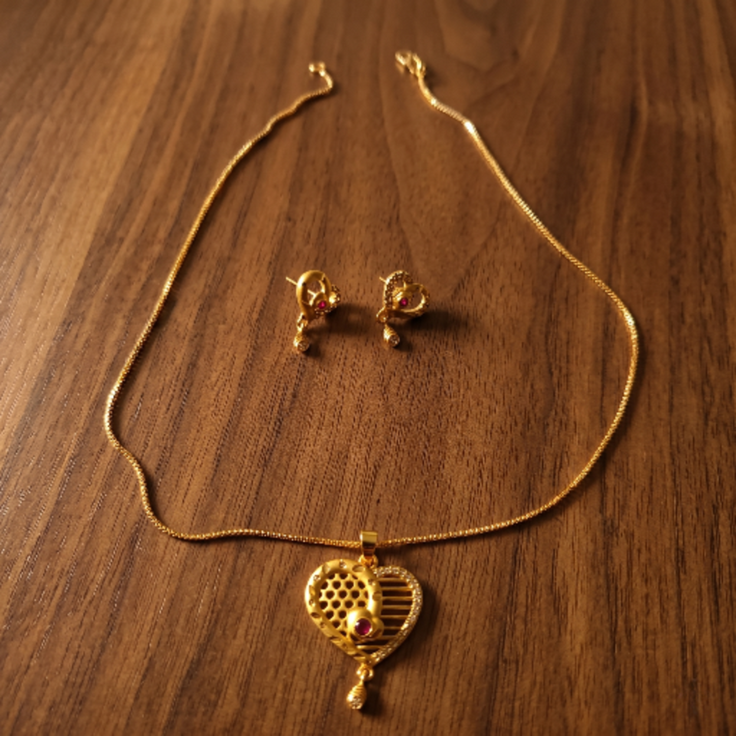 Gold Plated Heart Pendant Necklace with Earrings Set for Women - Ruby Red Stone Studded Traditional Jewellery Set - Adjustable Chain & Heart Drop Earrings for Weddings & Gifting